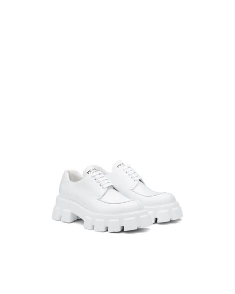 white laced up prada shoes